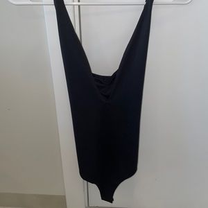 Back crossed crossed body suit